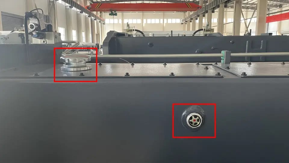 Pictures KRRASS press brake hydraulic oil filler port (upper left) and inspection port (lower right)