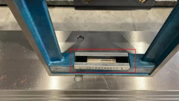 Pictures A level ruler should be placed horizontally in the middle of the press brake workbench