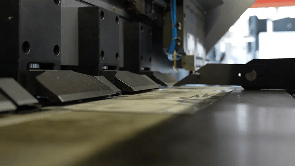 Place the metal plate on the workbench