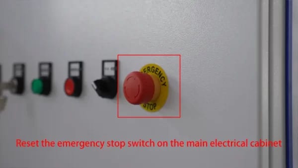 Reset the emergency stop switch on the main electrical cabinet