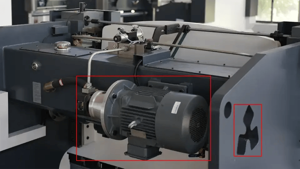 The main motor of the NC press brake (left) and the observation hole of the air leaf (right)