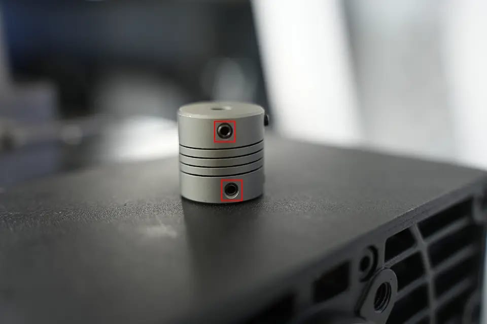 There are fixing screws on the top and bottom of the connector