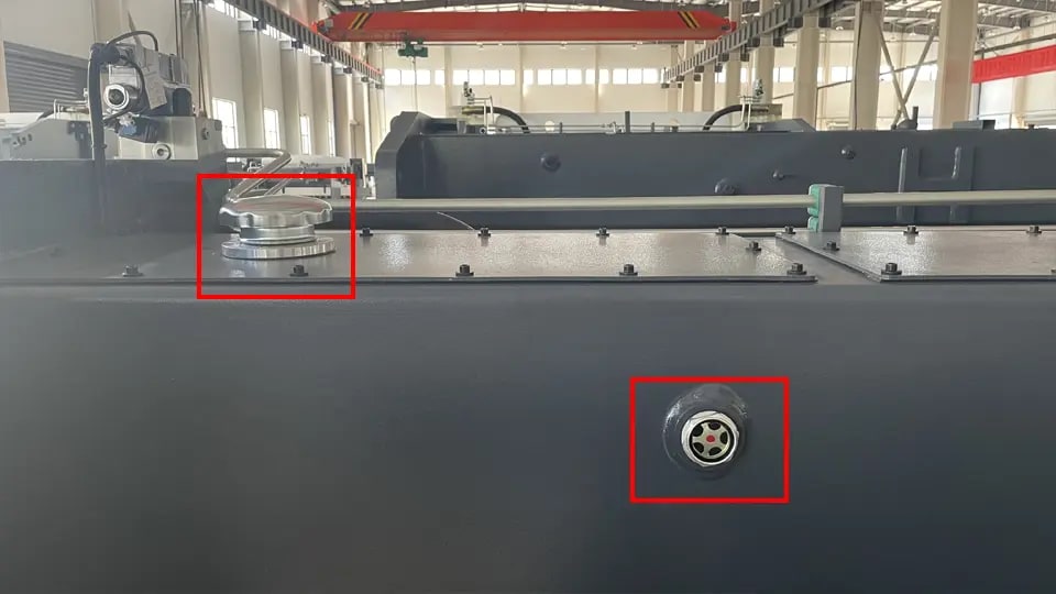 KRRASS press brake hydraulic oil filler port (upper left) and inspection port (lower right)