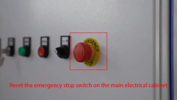 Reset the emergency stop switch on the main electrical cabinet
