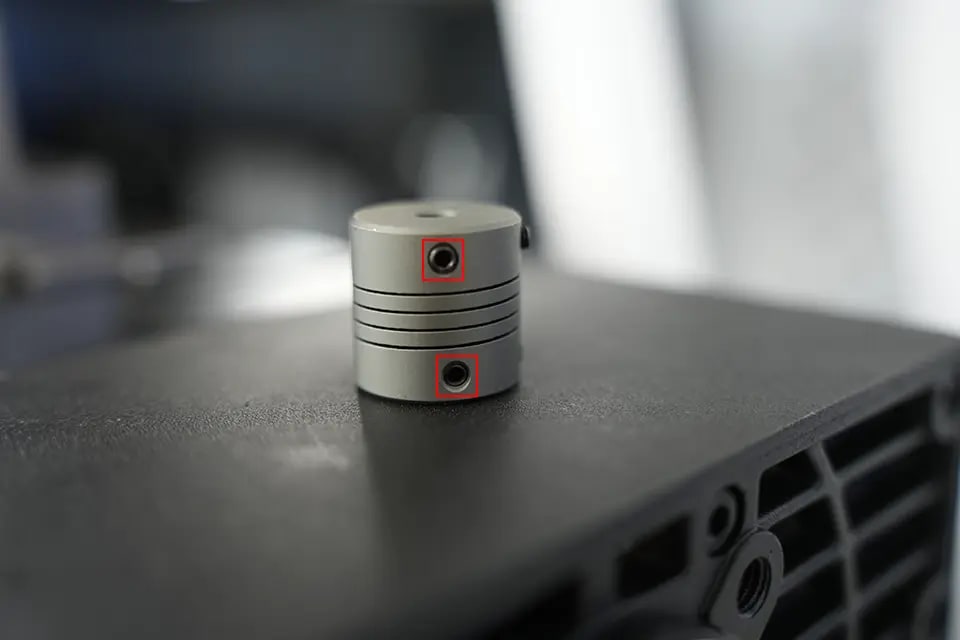 There are fixing screws on the top and bottom of the connector