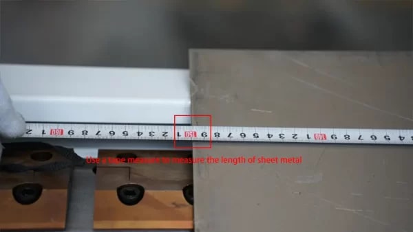 Use a tape measure to measure the length of sheet metal