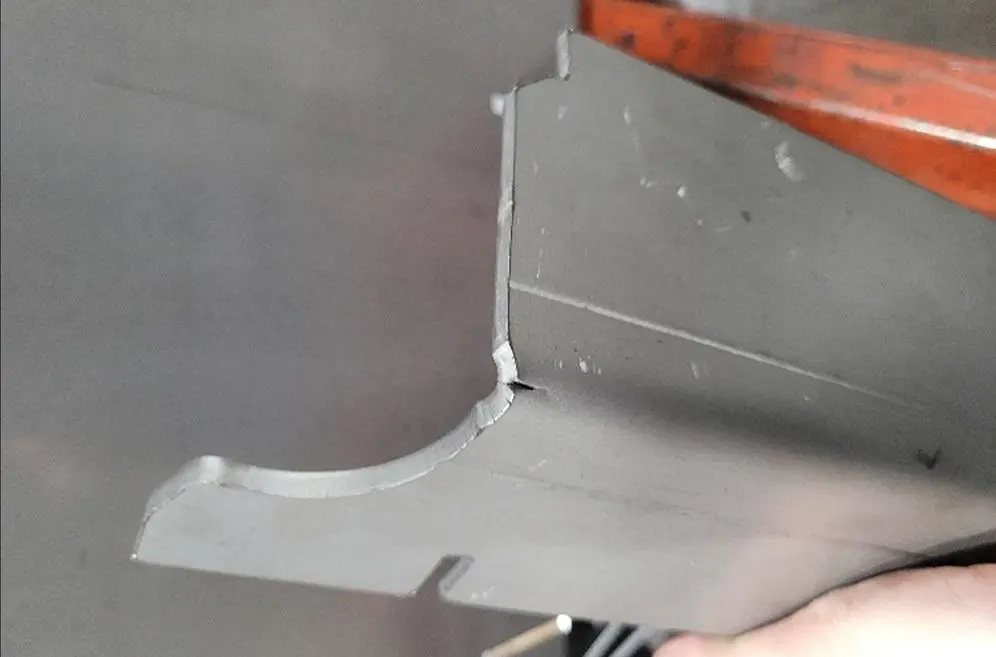 FIGURE 2. Cracking near a laser-cut edge can be caused by hardness issues resulting from an inadequate HAZ, combined with variations in material characteristics, especially considering that previous batches of parts were bent successfully.
