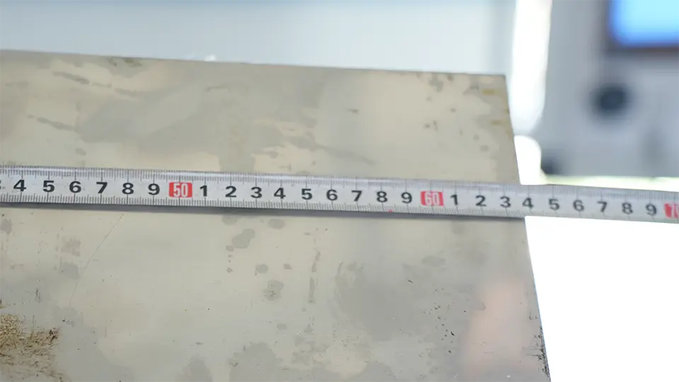 Measuring length of sheet metal