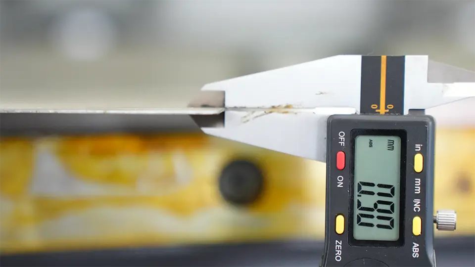 Measuring thickness of sheet metal